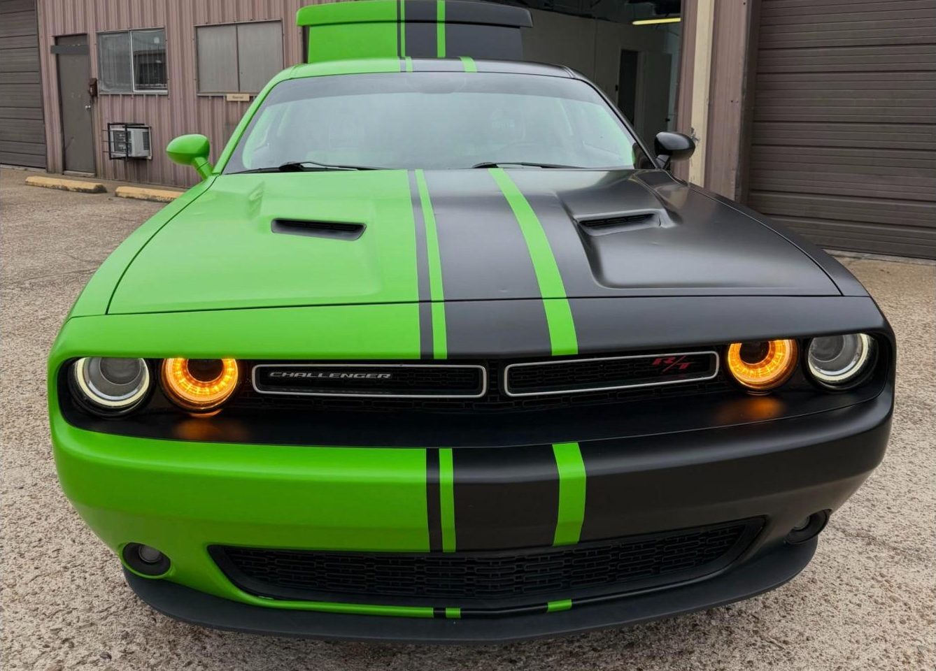 Dodge Challenger wrapped satin green with satin black stripes